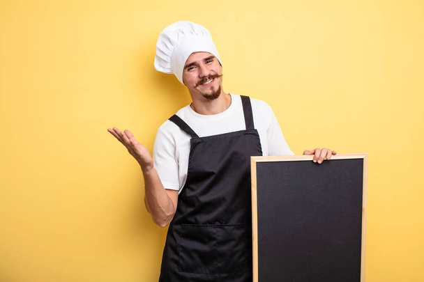 chef man feeling happy, surprised realizing a solution or idea - Foto, imagen
