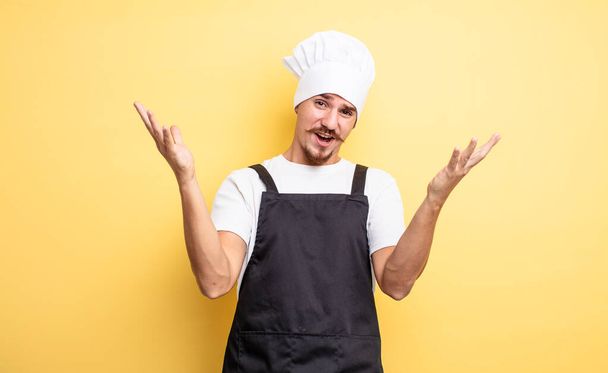 chef man feeling extremely shocked and surprised - Fotó, kép