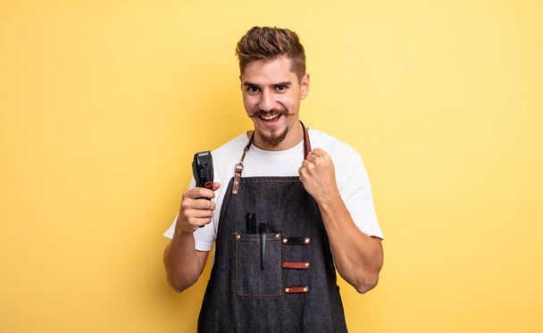 hipster barber man feeling shocked,laughing and celebrating success - Foto, afbeelding