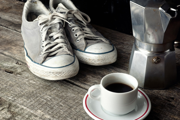 Espresso coffee, espresso maker and dirty sneakers - Фото, изображение