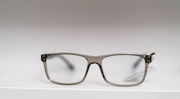 Close up of eyeglasses on the table. Corrective eyesight lenses. Stock photo - Foto, Imagen