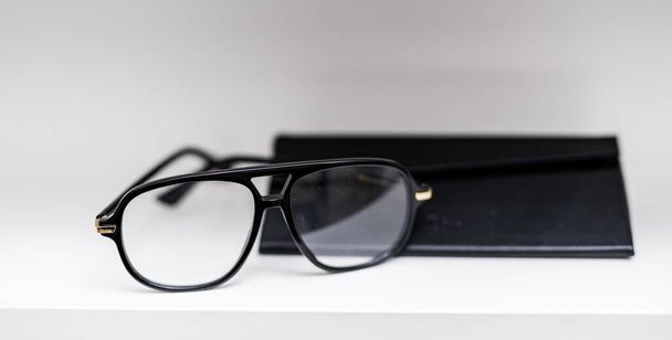 Optical modern accessory with lenses. Eyeglasses standing on white background. Stock photo - Φωτογραφία, εικόνα