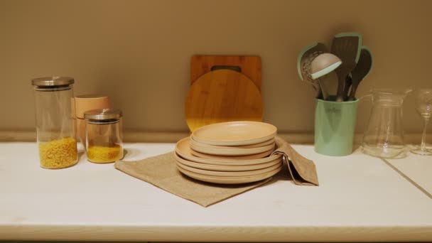 Kitchen interier. Modern kitchen interior. Plates are on a napkin - Footage, Video