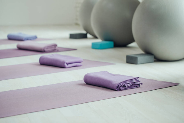 Yoga mats and balls. Yoga accessories, hall, room. - Fotoğraf, Görsel