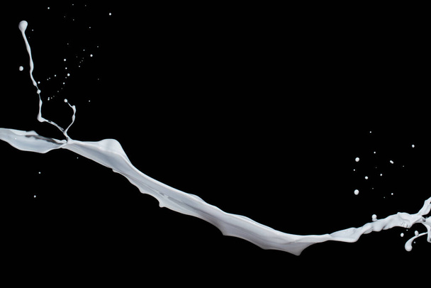 White paint splash isolated on black background. - Fotoğraf, Görsel