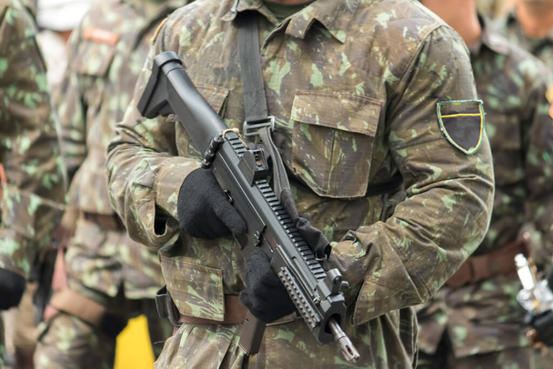 Army Soldier with machine gun in military parade. - Фото, изображение