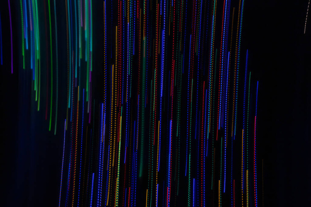 Colored light stripes background using intentional camera movement.on black background, - Foto, Imagem