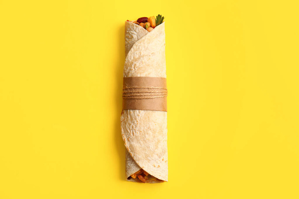 Delicious burrito on yellow background - Photo, Image