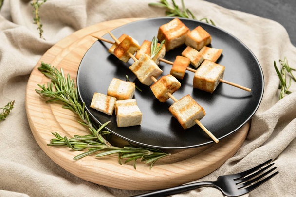 Plate with grilled tofu cheese skewers and rosemary on table, closeup - Photo, Image