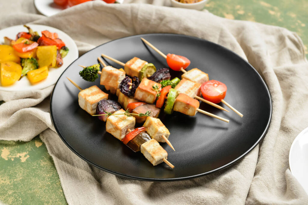 Plate with grilled tofu cheese skewers on color background, closeup - Photo, Image