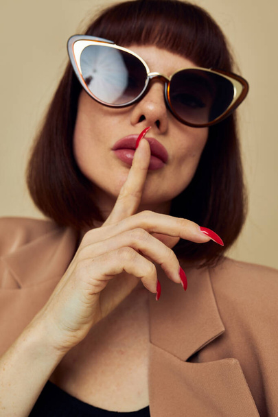 beautiful woman Charm red nails model luxury sunglasses light background - Φωτογραφία, εικόνα