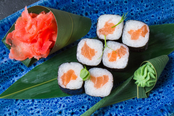 Fresh sushi dish on a blue plate - Valokuva, kuva