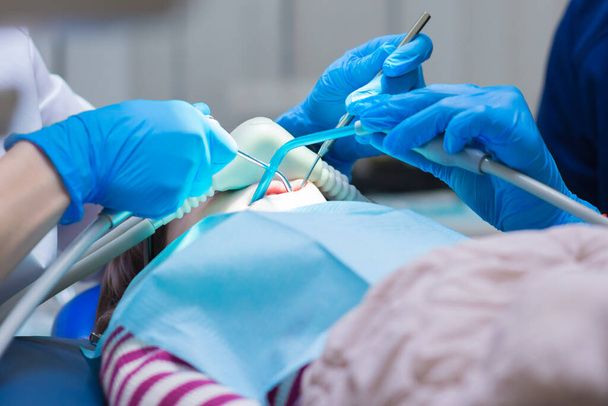 Dentistry. Little girl getting Inhalation Sedation while teeth treatment at dental clinic. Teeth treatment child. - Фото, зображення