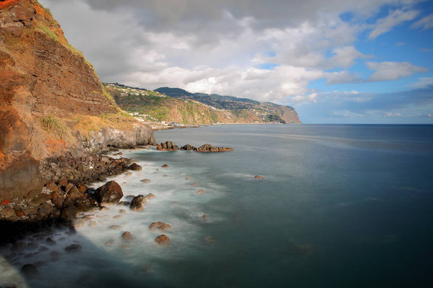 The South coast of Madeira Island, Portugal, viewed from Ponta de Sol towards the East - Foto, afbeelding