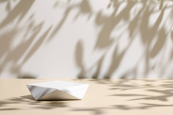 scene with polygonal podium on beige background and shadows - Фото, изображение