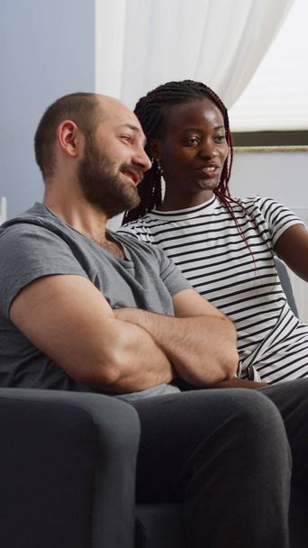 Interracial partners using video call on smartphone - Photo, Image