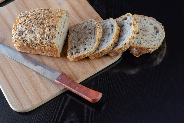 Breads fresh from the oven, made with sourdough and different types of cereals - 写真・画像