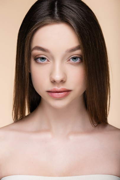 close up of brunette young woman isolated on beige  - Photo, Image