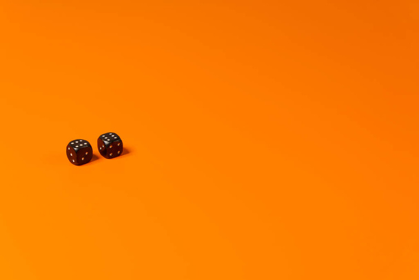 Lucky chance on game dice two sixes on orange background - Photo, Image