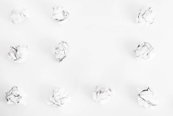 overhead shot of crumpled paper and copy space in the middle on white background. great idea concept on the white office table. Isolate. zero waste - Valokuva, kuva