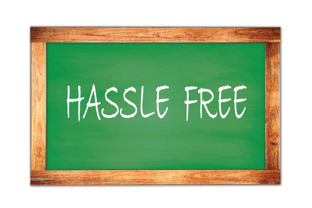 HASSLE  FREE text written on green wooden frame school blackboard. - Foto, Bild