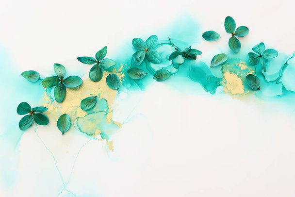 Creative image of emerald and green Hydrangea flowers on artistic ink background. Top view with copy space - Valokuva, kuva