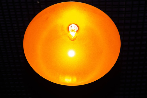 light bulb in the middle of the yellow circle - Photo, Image