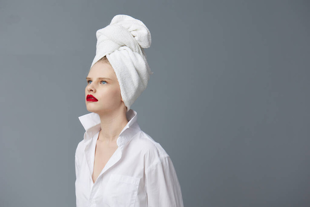 woman white shirt cosmetics with towel on head Lifestyle posing - Foto, imagen