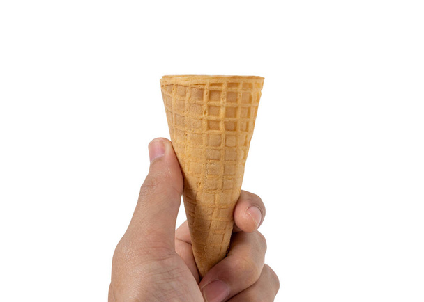 Hand a man hold ice cream cone isolated on a white background. - Foto, immagini
