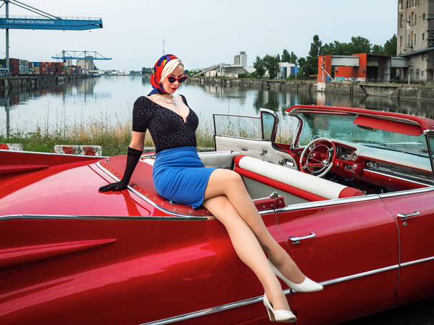 Old-timer red Cadillac and a beautiful young girl. France. - Foto, immagini