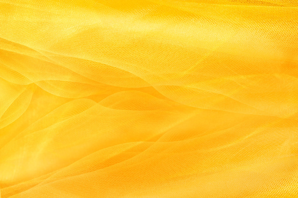 Yellow background, textiles and yellow mesh - Photo, Image