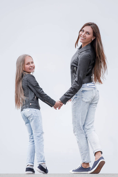 rear view. happy mother and daughter walk together. - Foto, Bild