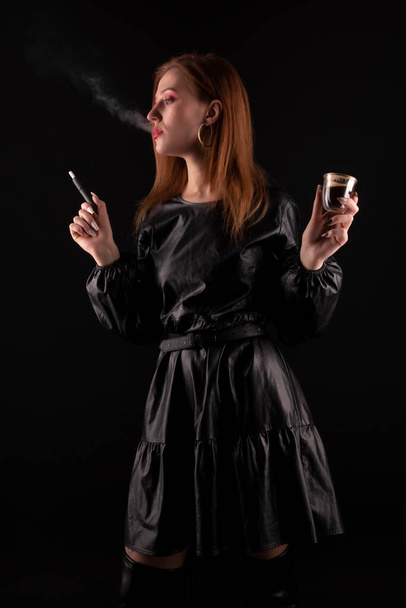 portrait of the beautiful young woman with a cigarette  - Foto, Bild