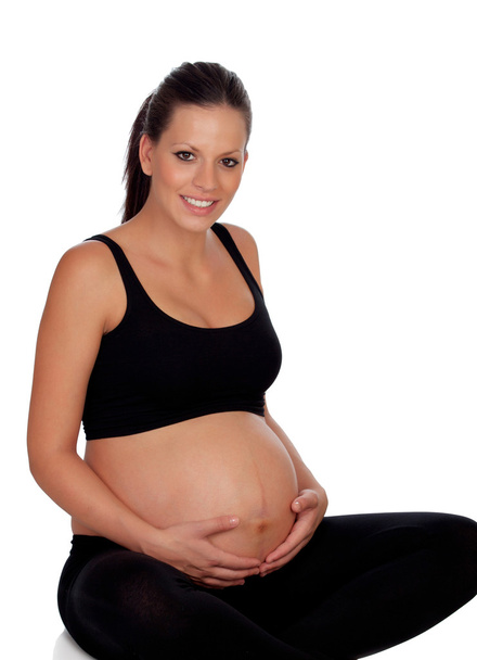 gyönyörű terhes nő ül a padlón - Fotó, kép