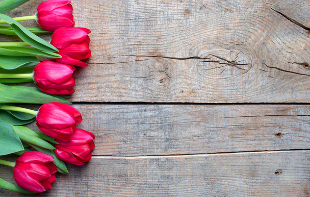 Tulips on an antique wooden background - Fotó, kép