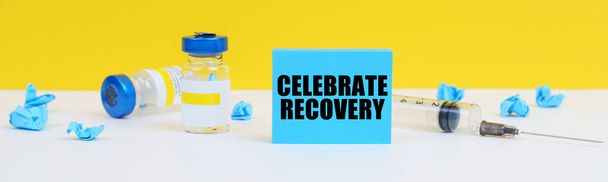 Medicine and health concept. On the table is a syringe, injections and a blue sign with the inscription - Celebrate Recovery - Foto, Imagem