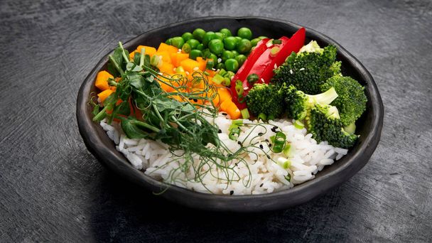 Bowl with rice, broccoli , pumpkin and microgreens. Healthy food diet concept - Foto, afbeelding
