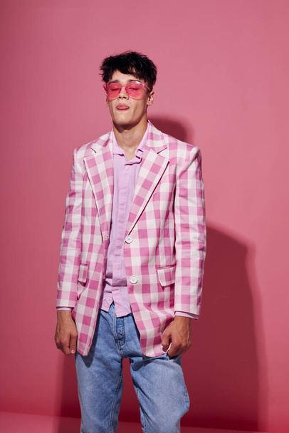A young man pink shirt and glasses jacket fashion elegant style isolated background unaltered - Foto, Imagem