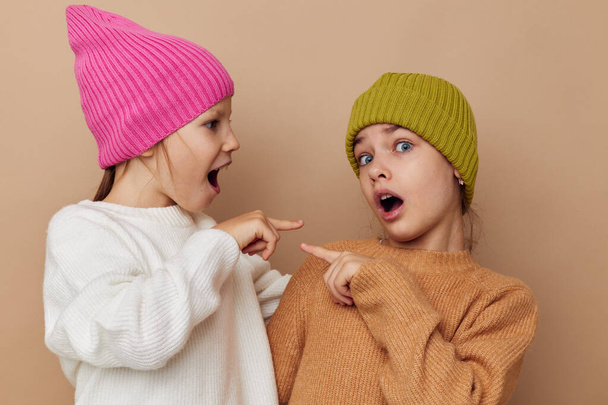 two cute little girls wearing hats fashion childhood - 写真・画像