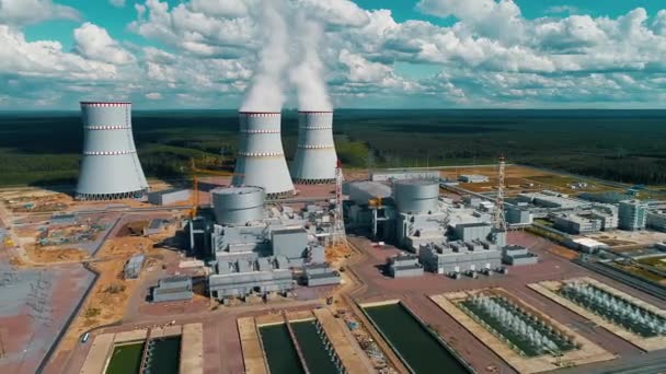 Power units and cooling towers with steam and smoke from a nuclear power plant  - Materiaali, video