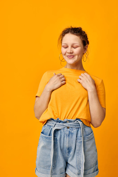funny girl summer style yellow tshirt posing isolated backgrounds unaltered - Фото, зображення
