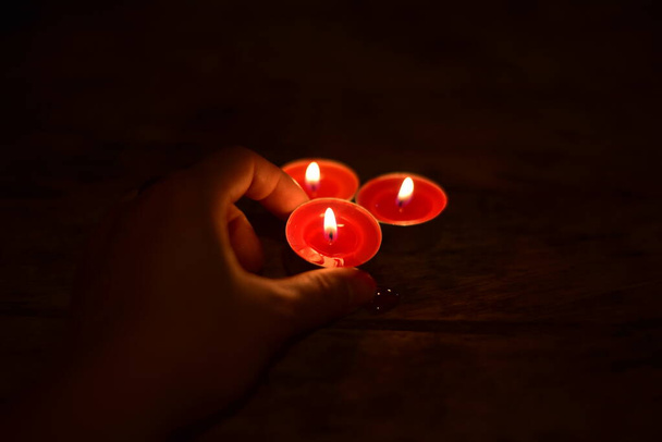 Candle light on dark background.Romance concept. - Фото, изображение