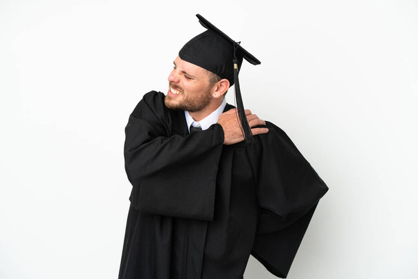 Young university Brazilian graduate isolated on white background suffering from pain in shoulder for having made an effort - Fotografie, Obrázek
