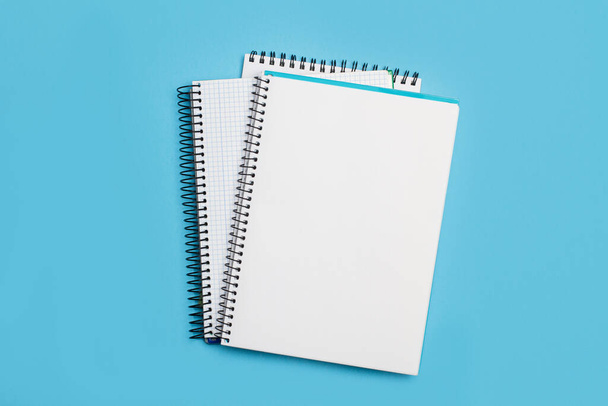 Blank notebooks on a light blue background - Foto, Imagem