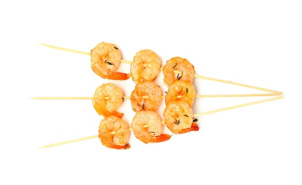 Tasty grilled shrimp skewers on white background - Foto, afbeelding
