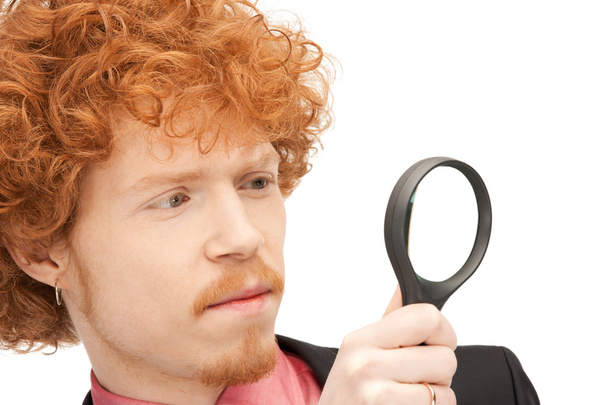 Man with magnifying glass - Foto, afbeelding