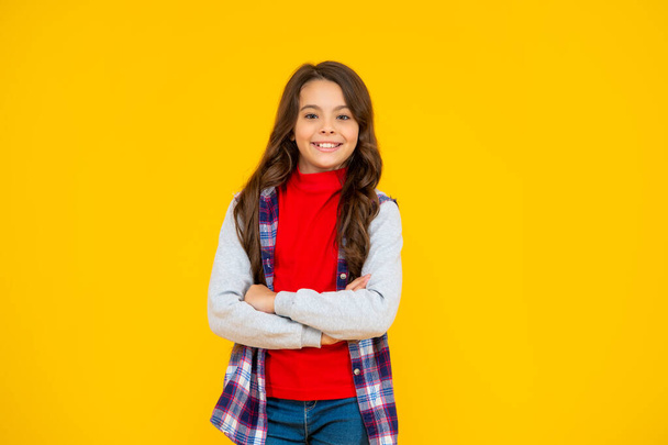 smiling kid in casual clothes on yellow background. happy childhood. - Fotoğraf, Görsel
