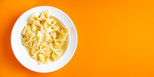 pasta farfalle healthy meal food snack on the table copy space food background - Фото, изображение