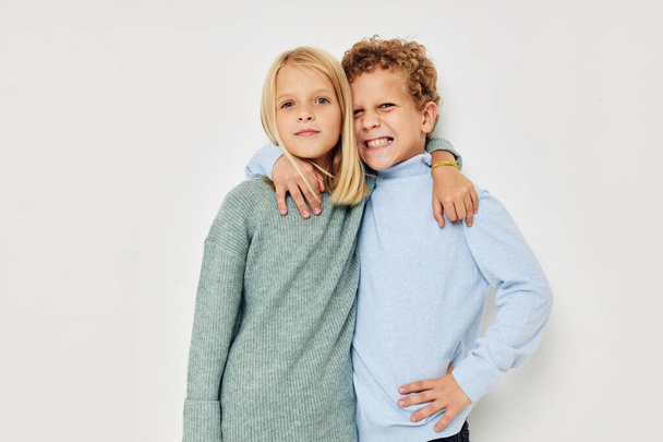 Photo of two children hug entertainment posing friendship isolated background - Foto, Imagen