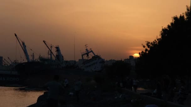 port silhoulette, ships in the port and silhouette of sunset, time lapse - Filmati, video
